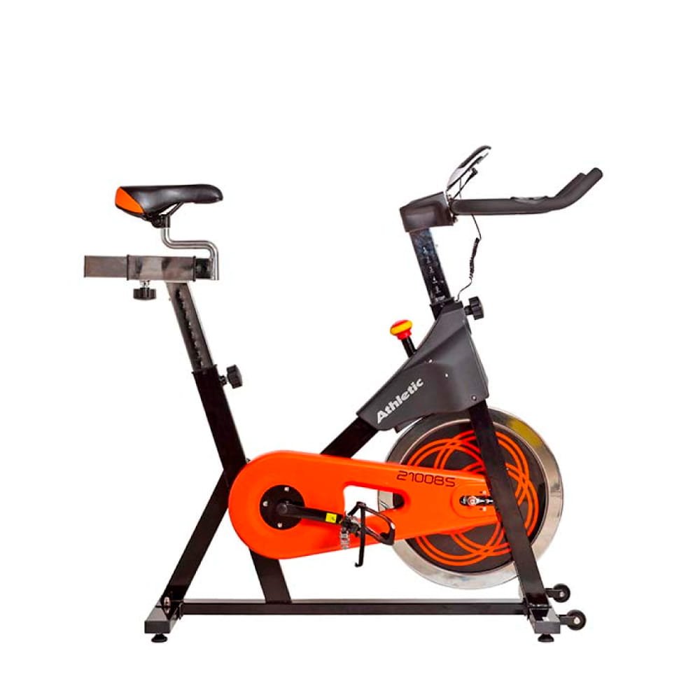 Bicicleta fija tipo indoor bike vista de costado. Convina colores negros con naranja